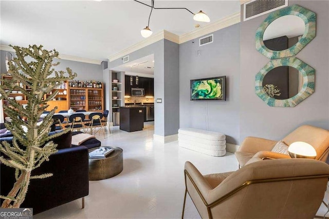 living area with baseboards, visible vents, and ornamental molding