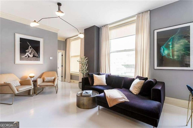 living room featuring ornamental molding and baseboards