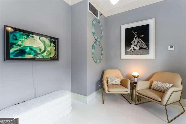 living area featuring ornamental molding, visible vents, and baseboards