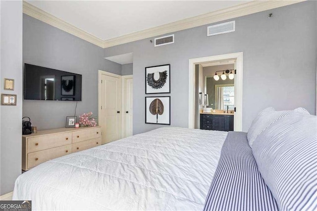 bedroom with ensuite bathroom, ornamental molding, and visible vents