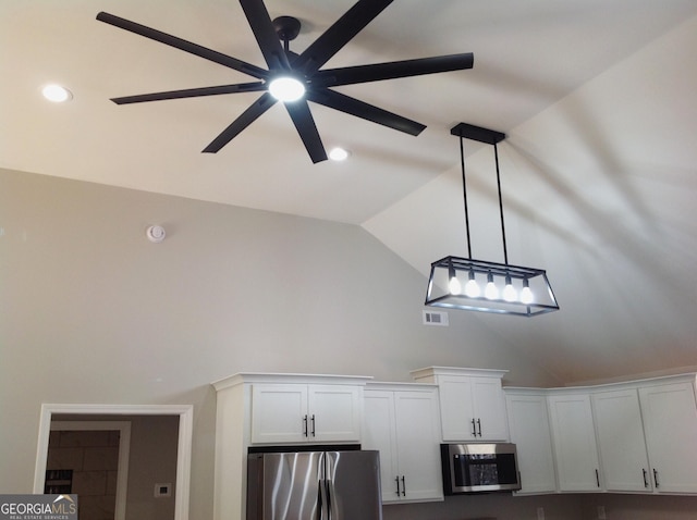 room details with visible vents, hanging light fixtures, appliances with stainless steel finishes, a ceiling fan, and white cabinets