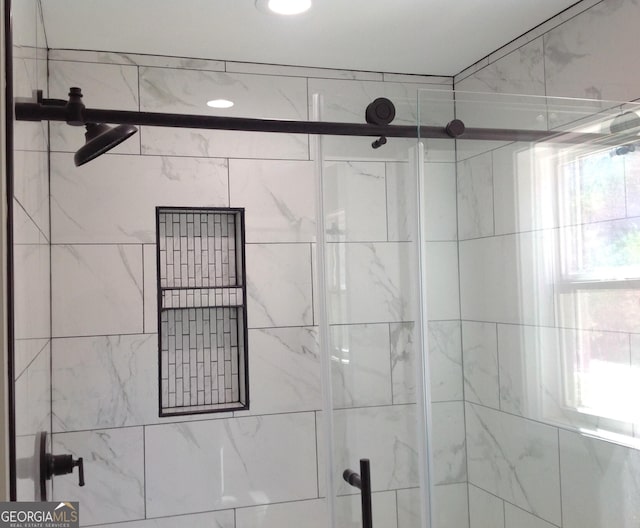 bathroom featuring a shower stall