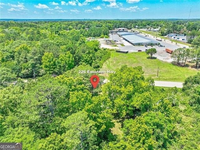 aerial view with a wooded view