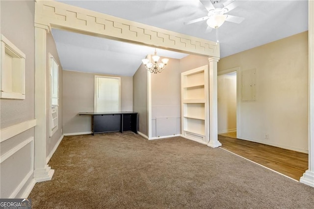 unfurnished bedroom featuring vaulted ceiling, carpet flooring, decorative columns, and baseboards