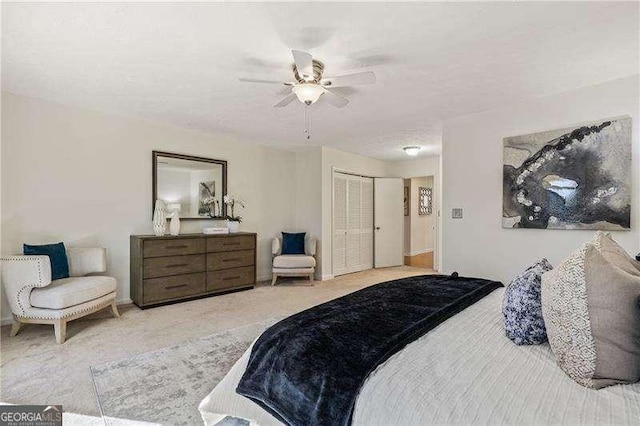 bedroom featuring carpet, a closet, and ceiling fan