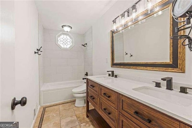 bathroom featuring tub / shower combination, a sink, toilet, and double vanity