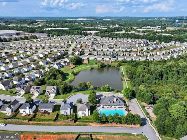 drone / aerial view with a water view and a residential view