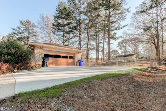 123 Creek Cir, Stockbridge, GA 30281 - surrounding community featuring a garage, an outbuilding, and fence