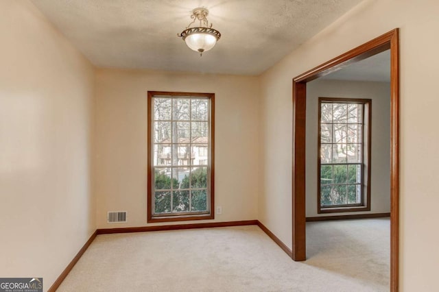 123 Creek Cir, Stockbridge, GA 30281 - empty room with carpet floors, visible vents, and baseboards
