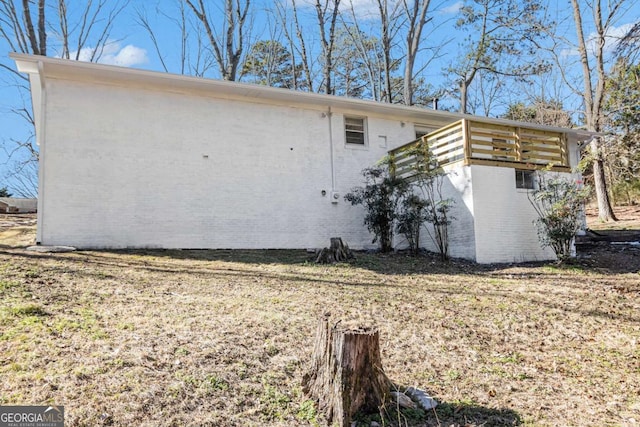 view of side of home featuring brick siding