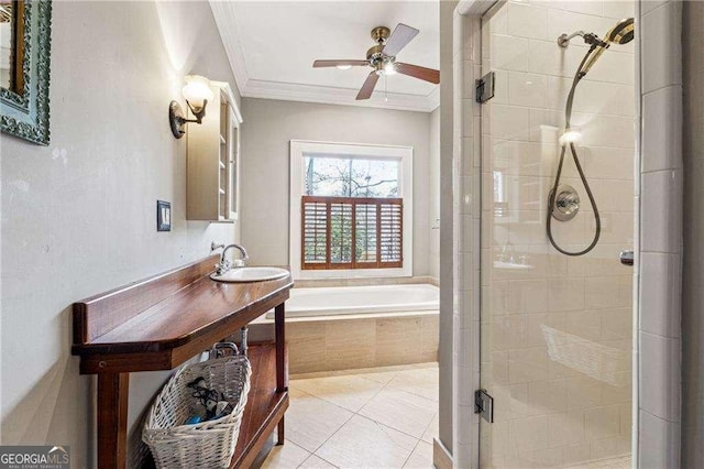 bathroom with vanity, a garden tub, a stall shower, crown molding, and tile patterned floors