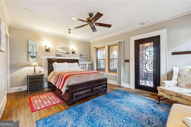 bedroom with a ceiling fan, wood finished floors, baseboards, and ornamental molding