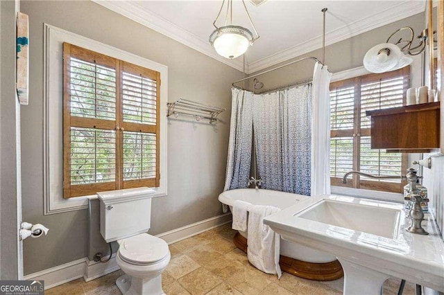 bathroom with toilet, a shower with shower curtain, crown molding, baseboards, and a soaking tub