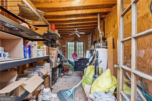 storage room featuring french doors and water heater