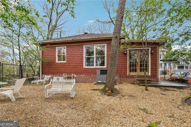 back of house featuring fence