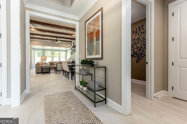 hall with beam ceiling and baseboards