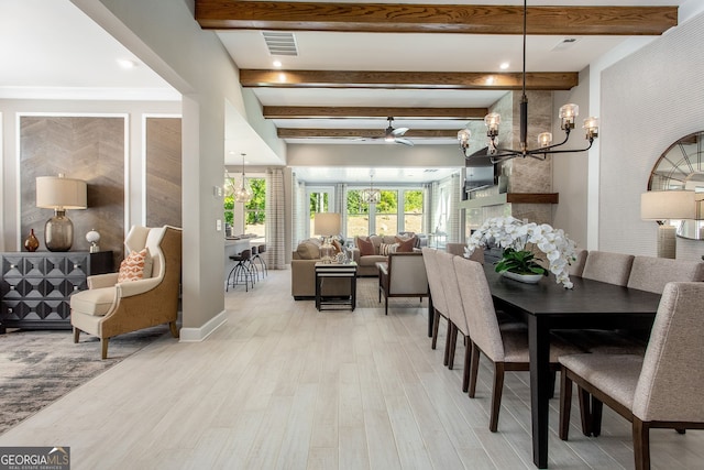 dining space featuring light wood-type flooring, a notable chandelier, visible vents, and beamed ceiling