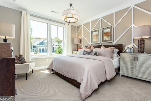 carpeted bedroom featuring visible vents and baseboards