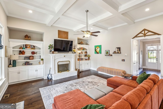 living area featuring coffered ceiling, dark wood-style flooring, visible vents, and beam ceiling