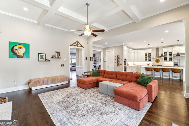 living area with dark wood-type flooring, coffered ceiling, and beamed ceiling