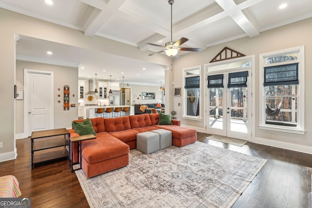 living room featuring baseboards, coffered ceiling, and dark wood-style flooring