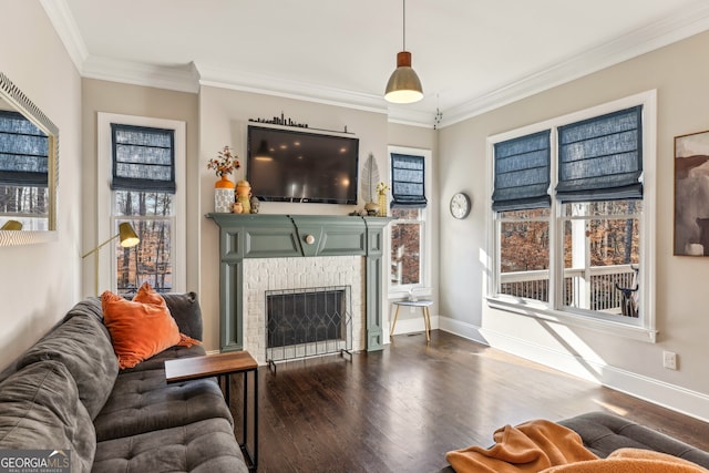 living room featuring baseboards, dark wood-style flooring, a fireplace, and crown molding