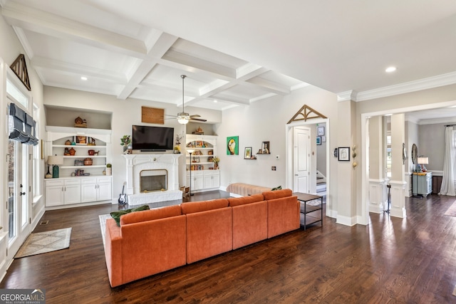 living area featuring dark wood-style floors, beam ceiling, coffered ceiling, and built in features