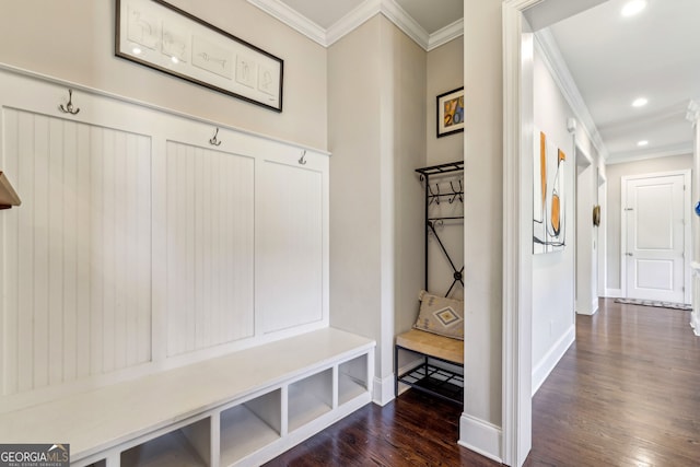 mudroom with ornamental molding, dark wood-type flooring, recessed lighting, and baseboards