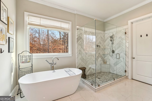 full bathroom featuring a stall shower, baseboards, marble finish floor, crown molding, and a freestanding tub