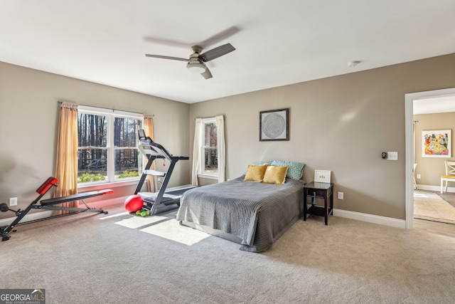 bedroom with carpet floors, ceiling fan, and baseboards