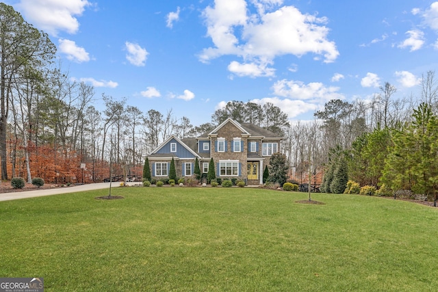 view of front of property featuring a front lawn and board and batten siding