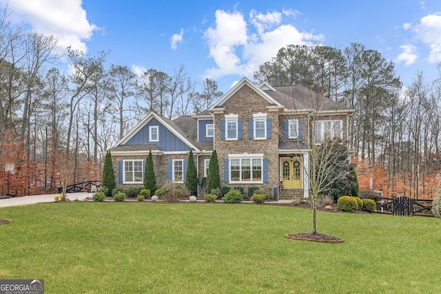 view of front of property featuring board and batten siding, french doors, and a front lawn