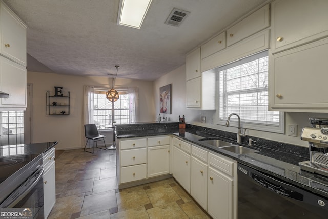 kitchen with black dishwasher, visible vents, white cabinets, a sink, and a peninsula