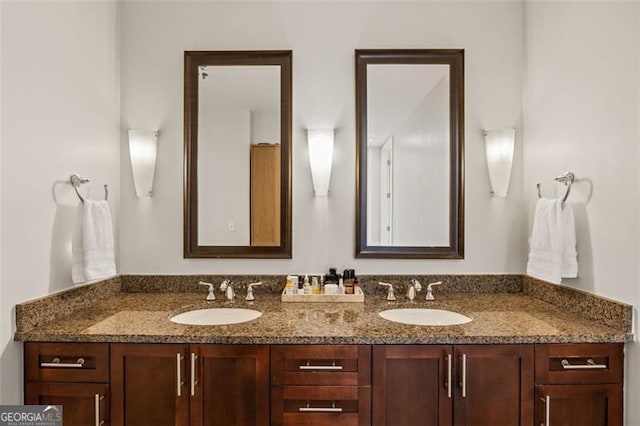 bathroom with double vanity and a sink