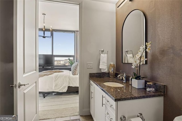 bathroom featuring connected bathroom and vanity