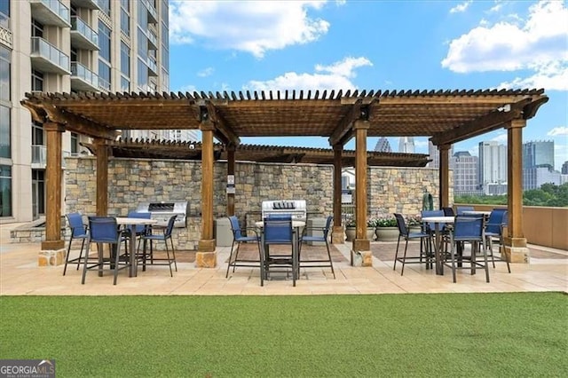 view of patio / terrace featuring outdoor dining area, a city view, and a pergola