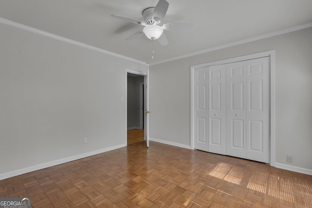 unfurnished bedroom with ornamental molding, a closet, and baseboards