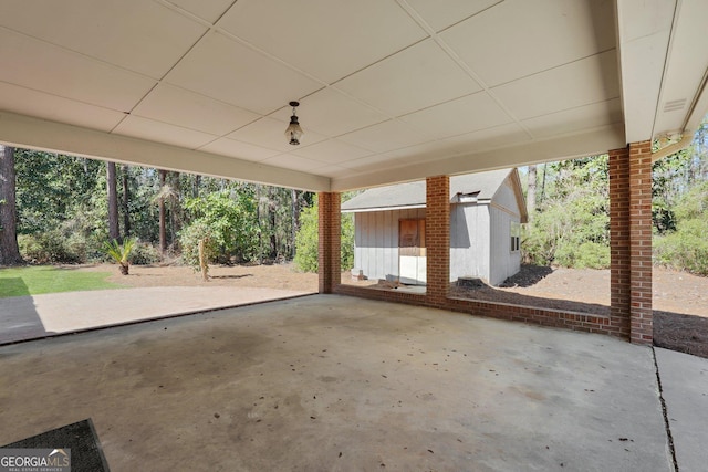 view of patio / terrace with an outbuilding