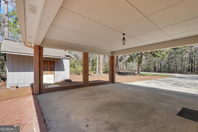 view of patio / terrace with a carport