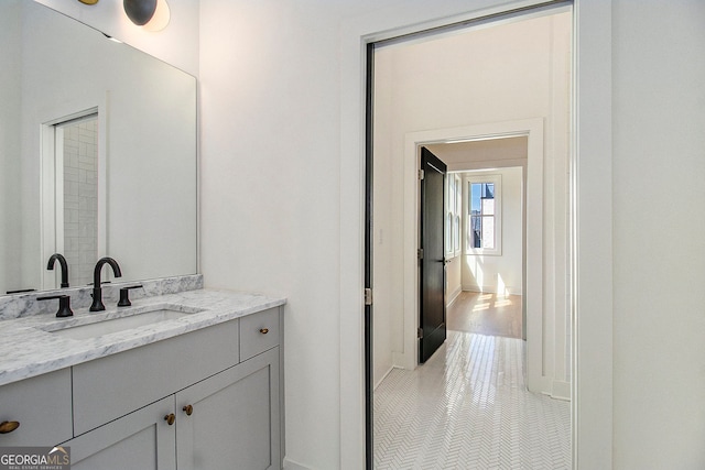 bathroom with tile patterned flooring and vanity