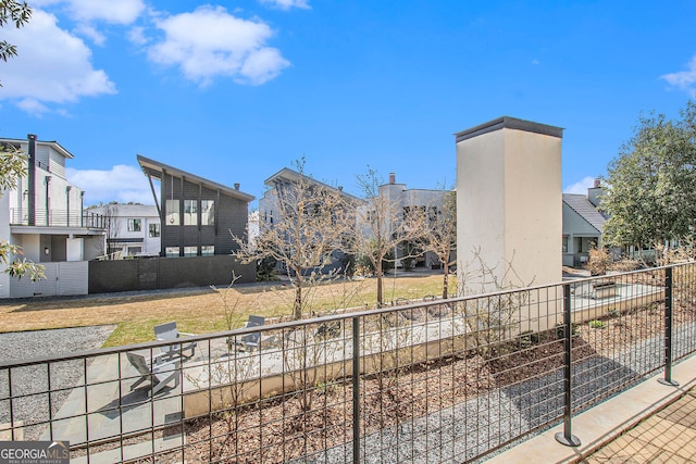 view of property's community with fence