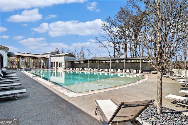 community pool with a patio