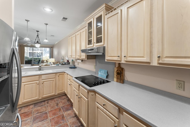 kitchen with stainless steel refrigerator with ice dispenser, black electric stovetop, visible vents, light brown cabinets, and under cabinet range hood