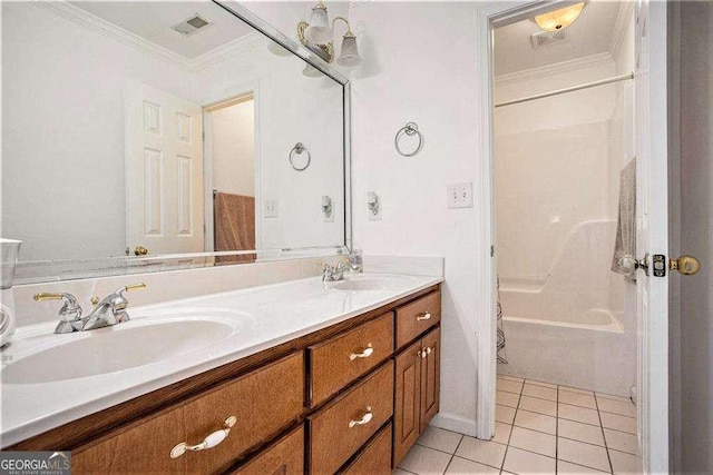 bathroom with tile patterned flooring, a sink,  shower combination, ornamental molding, and double vanity