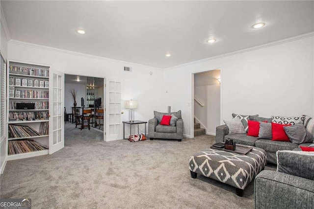 living room with carpet, french doors, visible vents, stairway, and ornamental molding