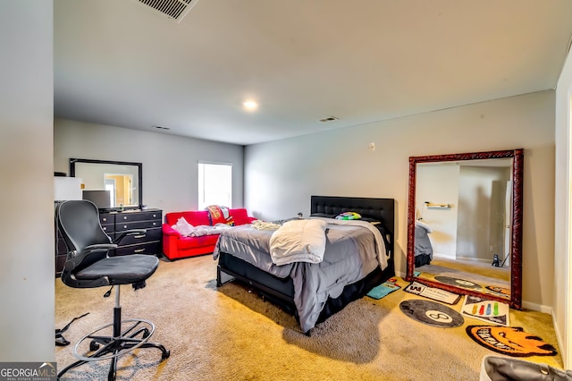 carpeted bedroom featuring visible vents and baseboards