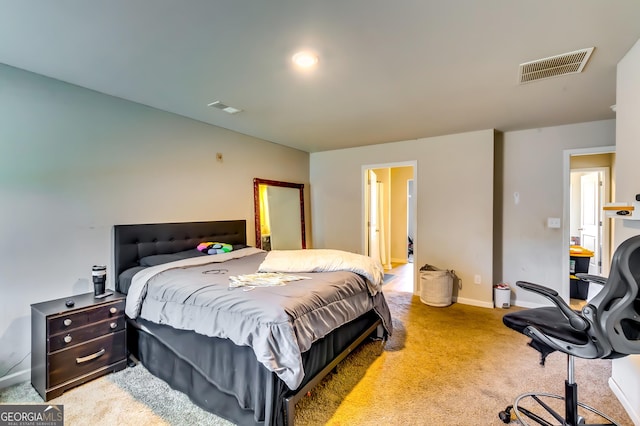 bedroom with visible vents, light carpet, and baseboards