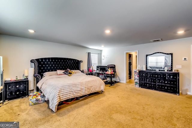 carpeted bedroom with recessed lighting, visible vents, and baseboards