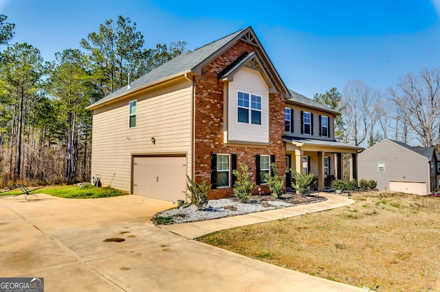 view of front facade featuring a garage, brick siding, and driveway