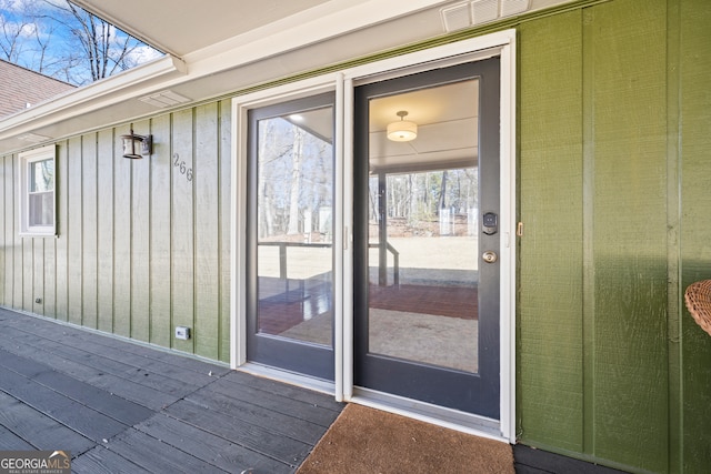 doorway to property featuring visible vents